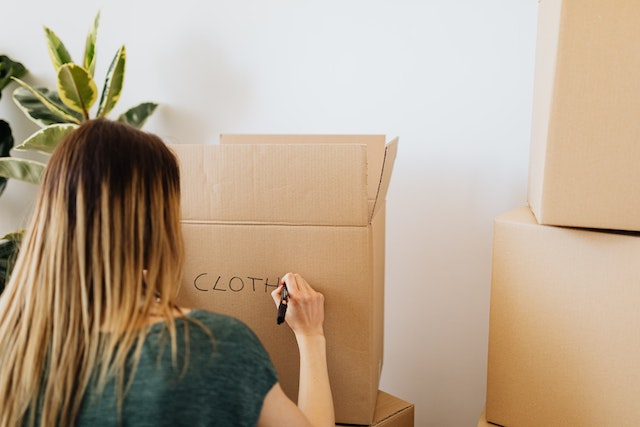 person packing moving boxes